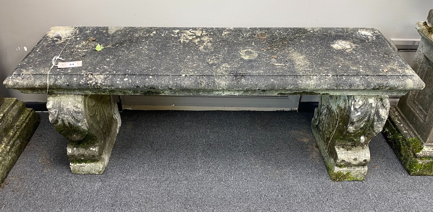 A reconstituted stone garden bench, length 126cm, depth 40cm, height 42cm